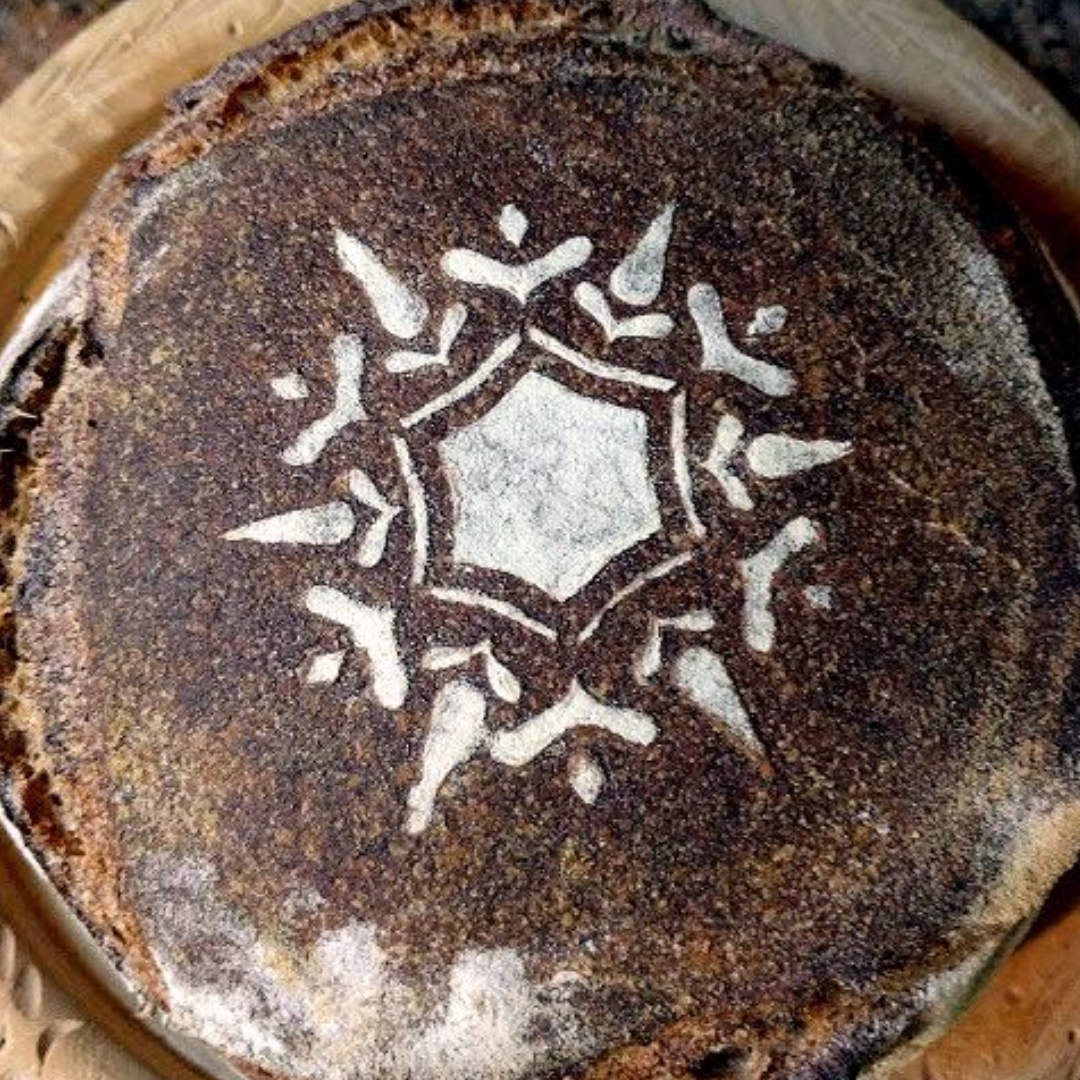 Close-up of a textured surface of a bread with a design that can be made from using a stencil design